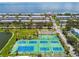 Aerial view of community showcasing tennis courts and lush landscaping at 4984 Beach Se Dr # B, St Petersburg, FL 33705