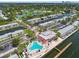 Wonderful aerial view of the community with a pool, clubhouse, docks, and landscaping at 4984 Beach Se Dr # B, St Petersburg, FL 33705