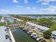 Aerial view of waterfront community with boats docked on canal and view of bay at 4984 Beach Se Dr # B, St Petersburg, FL 33705