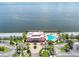 Aerial view of community clubhouse with swimming pool, parking lot, and waterfront views at 4984 Beach Se Dr # B, St Petersburg, FL 33705