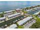 An aerial view shows a waterfront residential community with boats docked on canals and parking areas at 4984 Beach Se Dr # B, St Petersburg, FL 33705