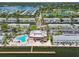 Aerial view of community clubhouse with swimming pool, tennis courts, boat docks, and bay views at 4984 Beach Se Dr # B, St Petersburg, FL 33705