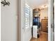 Walk-in closet with white shutters, shelving, and storage for organization at 4984 Beach Se Dr # B, St Petersburg, FL 33705