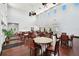 Spacious clubhouse with tall ceilings, ceiling fans, tables and chairs, and view to outdoor patio at 4984 Beach Se Dr # B, St Petersburg, FL 33705