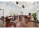 A great room or community space with multiple tables, chairs, ceiling fans and wood floors at 4984 Beach Se Dr # B, St Petersburg, FL 33705