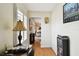 Bright hallway with hardwood floors leads to a cozy living area at 4984 Beach Se Dr # B, St Petersburg, FL 33705