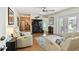 Inviting living room featuring hardwood floors, comfortable seating, and a seamless transition to the kitchen at 4984 Beach Se Dr # B, St Petersburg, FL 33705