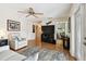Comfortable living room with hardwood floors, neutral walls, and a view into an adjacent office space at 4984 Beach Se Dr # B, St Petersburg, FL 33705