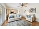 Bright living room boasts wood floors, comfortable seating, and plenty of natural light with easy access to dining area at 4984 Beach Se Dr # B, St Petersburg, FL 33705