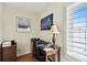 Home office with a window, desk, chair, and shelving for organization at 4984 Beach Se Dr # B, St Petersburg, FL 33705