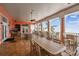 A covered patio with multiple tables, chairs, ceiling fans and ocean views at 4984 Beach Se Dr # B, St Petersburg, FL 33705