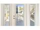 Patio door with blinds leading to outdoor seating at 4984 Beach Se Dr # B, St Petersburg, FL 33705