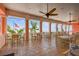 Covered patio seating area offering scenic ocean views with palm trees and an American flag at 4984 Beach Se Dr # B, St Petersburg, FL 33705