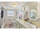 Bathroom featuring double sinks and a large mirror at 5200 Brittany S Dr # 1501, St Petersburg, FL 33715