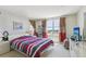 Bedroom with city view and striped bedding at 5200 Brittany S Dr # 1501, St Petersburg, FL 33715