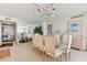 Formal dining area featuring a glass-top table, seating for six, and ample natural light at 5200 Brittany S Dr # 1501, St Petersburg, FL 33715