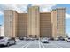 Spacious condo building exterior with parking lot and a neutral color palette on a sunny day at 5200 Brittany S Dr # 1501, St Petersburg, FL 33715