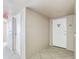 Condo hallway with tile flooring, unit number 1501, and a view of the fire extinguisher at 5200 Brittany S Dr # 1501, St Petersburg, FL 33715