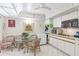 Cozy kitchen with an eat-in dining table, white cabinetry, and modern appliances at 5200 Brittany S Dr # 1501, St Petersburg, FL 33715