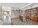Resident library area showcasing wooden shelving and a diverse collection of books at 5200 Brittany S Dr # 1501, St Petersburg, FL 33715