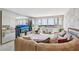 Bright living room with mirrored walls, large windows, and comfortable seating area with nice outside views at 5200 Brittany S Dr # 1501, St Petersburg, FL 33715