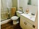 Cozy bathroom featuring a shower, a white toilet, and a vanity with storage at 5623 80Th N St # 406, St Petersburg, FL 33709