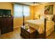 Well-lit bedroom with furnishings, wood floors, and a ceiling fan at 5623 80Th N St # 406, St Petersburg, FL 33709
