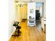 Open hallway showcasing wood floors, lighting, and interior decor at 5623 80Th N St # 406, St Petersburg, FL 33709