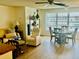Inviting living room featuring a dining area and lots of natural light at 5623 80Th N St # 406, St Petersburg, FL 33709