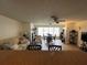 Inviting living room space with a dining area, and a ceiling fan, featuring neutral tones at 5623 80Th N St # 406, St Petersburg, FL 33709
