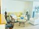 Well-lit living area with stylish furniture and natural light at 5623 80Th N St # 406, St Petersburg, FL 33709
