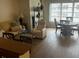 Comfortable living room showcasing decor, natural light, and wood floors at 5623 80Th N St # 406, St Petersburg, FL 33709