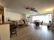 Open living space featuring wood-look flooring, seamlessly connected to a dining area at 5623 80Th N St # 406, St Petersburg, FL 33709