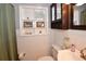 Bathroom view showing a toilet, sink with brushed nickel faucet, and medicine cabinet at 5628 2Nd N Ave, St Petersburg, FL 33710
