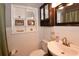 This bathroom features a toilet, sink with brushed nickel faucet, and medicine cabinet at 5628 2Nd N Ave, St Petersburg, FL 33710