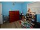 Bedroom featuring LVP flooring and a wooden dresser at 5628 2Nd N Ave, St Petersburg, FL 33710