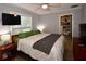 Bedroom featuring carpet, a ceiling fan, and a TV at 5628 2Nd N Ave, St Petersburg, FL 33710