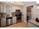 Updated kitchen featuring stainless appliances, gray cabinets, and stylish backsplash accents at 5628 2Nd N Ave, St Petersburg, FL 33710