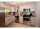 Modern kitchen featuring stainless steel appliances, granite countertops, and sleek cabinetry for storage at 5628 2Nd N Ave, St Petersburg, FL 33710