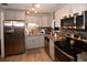 Updated kitchen with stainless steel appliances, granite countertops, and ample cabinet storage space at 5628 2Nd N Ave, St Petersburg, FL 33710