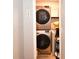 Compact laundry closet with stacked washer and dryer, maximizing space efficiency at 5628 2Nd N Ave, St Petersburg, FL 33710