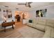 Inviting living room with a modern ceiling fan, an open floorplan, and access to the kitchen at 5628 2Nd N Ave, St Petersburg, FL 33710