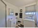 Bathroom features a shower, vanity sink, toilet and washing machine at 5695 40Th N Ave # 301, Kenneth City, FL 33709