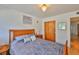 Warm bedroom with wooden accents, a view of a closet, and soft lighting at 5695 40Th N Ave # 301, Kenneth City, FL 33709