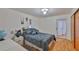 Comfortable bedroom with a closet, warm lighting, and traditional decor at 5695 40Th N Ave # 301, Kenneth City, FL 33709