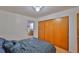 Cozy bedroom with a closet view, warm lighting, and classic style at 5695 40Th N Ave # 301, Kenneth City, FL 33709