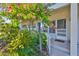 Charming condo entrance with vibrant landscaping and inviting front door at 5695 40Th N Ave # 301, Kenneth City, FL 33709
