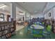 Community library area with bookshelves, tables, chairs, and reading nooks at 5695 40Th N Ave # 301, Kenneth City, FL 33709