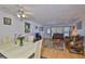 Open-concept living and dining area with wood floors and ample natural light at 5695 40Th N Ave # 301, Kenneth City, FL 33709