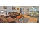 Cozy living room with hardwood floors, elegant furniture, and abundant natural light at 5695 40Th N Ave # 301, Kenneth City, FL 33709